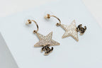 Gold-Tone Star Earrings with Crystal Embellishments and CC Logo
