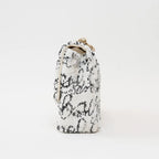 Pre-Loved Chanel™ White and Black Sequin Logo Flap Bag Coeur Cult Core